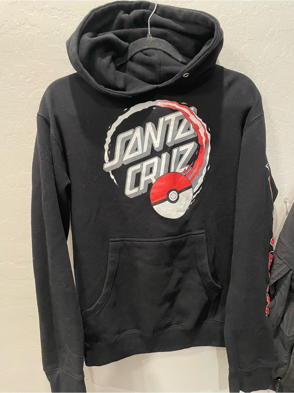 Pokemon Santa Cruz collab is  Black Hoodie with White Pikachu and Orange Outline